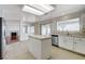 Kitchen with an island, stainless steel appliances and tile floors, offering great functionality and style at 5 Tarryall Ter, Henderson, NV 89074