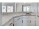 Bright kitchen with tile countertops, white cabinets and modern hardware at 5 Tarryall Ter, Henderson, NV 89074