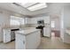 Bright kitchen with stainless steel appliances, an island and white cabinets, offering a fresh look at 5 Tarryall Ter, Henderson, NV 89074