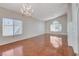 Spacious living room with hardwood floors, large windows, and a high ceiling allowing for plenty of natural light at 5 Tarryall Ter, Henderson, NV 89074