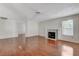 Bright living room featuring a fireplace, neutral paint, and laminate floors at 5 Tarryall Ter, Henderson, NV 89074