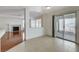 Open-concept area featuring a fireplace, and sliding door access to the patio at 5 Tarryall Ter, Henderson, NV 89074