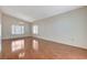 Spacious living room with attractive wood flooring, chandelier, and many windows at 5 Tarryall Ter, Henderson, NV 89074