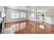 Open-concept living area with fireplace, laminate floors, and a view into the kitchen at 5 Tarryall Ter, Henderson, NV 89074