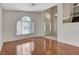 Bright and spacious living room featuring beautiful wood floors and a large window at 5 Tarryall Ter, Henderson, NV 89074