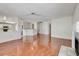Spacious living room with wood floors, fireplace, and an open layout to the kitchen at 5 Tarryall Ter, Henderson, NV 89074