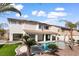 Spacious backyard with a pool, spa, covered patio, and desert landscaping at 5225 Villa Dante Ave, Las Vegas, NV 89141