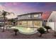 Stunning backyard with a sparkling pool, spa, and covered patio perfect for entertaining, under a lovely sunset at 5225 Villa Dante Ave, Las Vegas, NV 89141