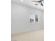 Well lit bedroom featuring a ceiling fan, carpet, and plantation shutters at 5225 Villa Dante Ave, Las Vegas, NV 89141