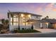 Elegant two-story home with a three-car garage and well-manicured landscaping at 5225 Villa Dante Ave, Las Vegas, NV 89141