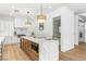 Spacious kitchen features an island, stainless steel appliances, custom cabinets, and a walk-in pantry at 5225 Villa Dante Ave, Las Vegas, NV 89141