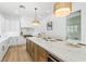 Kitchen island featuring white marble countertop, pendant lighting, and modern backsplash at 5225 Villa Dante Ave, Las Vegas, NV 89141