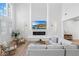Bright living room with tall ceilings, fireplace and comfortable seating area at 5225 Villa Dante Ave, Las Vegas, NV 89141