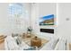 Bright living room with tall ceilings, fireplace, and comfortable seating area at 5225 Villa Dante Ave, Las Vegas, NV 89141