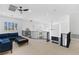 Bright loft with a blue couch and black railing overlooking the lower level at 5225 Villa Dante Ave, Las Vegas, NV 89141