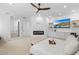 Main bedroom suite with modern fireplace, ceiling fan, and built in TV console at 5225 Villa Dante Ave, Las Vegas, NV 89141