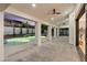 Large covered patio with ceiling fans provides ample space overlooking a sparkling pool and spa at 5225 Villa Dante Ave, Las Vegas, NV 89141