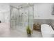 Luxurious glass shower with dual shower heads and marble tile at 5225 Villa Dante Ave, Las Vegas, NV 89141