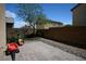 Paver patio and rock landscaping with a tree and block wall in a private backyard at 53 Hoke Edward Ct, North Las Vegas, NV 89031