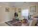 room with blue accent rug, natural light, crown molding, and a neutral color palette at 53 Hoke Edward Ct, North Las Vegas, NV 89031