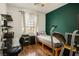 Functional bedroom with an exercise machine, a desk and a single bed at 53 Hoke Edward Ct, North Las Vegas, NV 89031