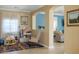 Bonus room with an archway that provides an open feel, wood look flooring, and natural light at 53 Hoke Edward Ct, North Las Vegas, NV 89031