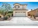 Charming two-story home features a well-manicured yard and attached two car garage at 53 Hoke Edward Ct, North Las Vegas, NV 89031