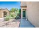 Home with a green front door and desert landscaping for an inviting curb appeal at 53 Hoke Edward Ct, North Las Vegas, NV 89031
