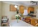 Kitchen and dining area with wooden cabinets and a breakfast nook at 53 Hoke Edward Ct, North Las Vegas, NV 89031