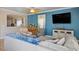 Cozy living room with blue accent wall and comfortable seating arrangement at 53 Hoke Edward Ct, North Las Vegas, NV 89031