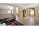 Open floorplan with bonus room leading to dining room and living room, with neutral tile and paint at 53 Hoke Edward Ct, North Las Vegas, NV 89031
