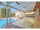 Covered patio with a view of the refreshing backyard pool at 5317 Holmby Ave, Las Vegas, NV 89146