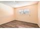 This bedroom features hardwood floors and a security window at 5317 Holmby Ave, Las Vegas, NV 89146
