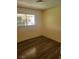 Empty bedroom with wood floors and window at 5317 Holmby Ave, Las Vegas, NV 89146