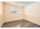 Bedroom with a window and closet space, enhanced by wood-look flooring at 5317 Holmby Ave, Las Vegas, NV 89146