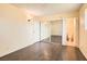 Bedroom featuring mirrored sliding closet doors and wood-look flooring at 5317 Holmby Ave, Las Vegas, NV 89146