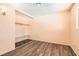 This bedroom features hardwood floors, overhead lighting, and a closet at 5317 Holmby Ave, Las Vegas, NV 89146