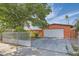 Single-story house features a driveway, mature trees, and a gated front yard at 5317 Holmby Ave, Las Vegas, NV 89146