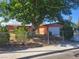 Charming single-story home featuring a large tree, well-maintained landscaping, and a fenced yard at 5317 Holmby Ave, Las Vegas, NV 89146