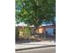 Charming single-story home featuring a large tree, well-maintained landscaping, and a fenced yard at 5317 Holmby Ave, Las Vegas, NV 89146