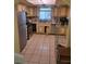 Functional kitchen featuring stainless steel appliances, tile backsplash, and ample storage at 5317 Holmby Ave, Las Vegas, NV 89146