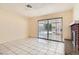Living room includes tile floors, access to the backyard, and a brick fireplace at 5317 Holmby Ave, Las Vegas, NV 89146