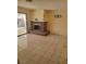 Inviting living room with fireplace, tile flooring, and sliding glass door offering outdoor access at 5317 Holmby Ave, Las Vegas, NV 89146