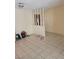 View of the living room with tile flooring and partition wall at 5317 Holmby Ave, Las Vegas, NV 89146