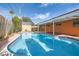 A refreshing backyard pool offers an oasis for outdoor enjoyment at 5317 Holmby Ave, Las Vegas, NV 89146