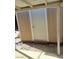 Shed with white door, and covered patio, offering versatile storage for various outdoor and lifestyle needs at 5317 Holmby Ave, Las Vegas, NV 89146