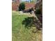 Landscaped backyard with a decorative rock pond and lush greenery, for tranquil outdoor enjoyment at 5466 Scotch Cap Dr, Las Vegas, NV 89122