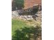 Landscaped backyard with a decorative rock pond, perfect for relaxation and enjoying nature at 5466 Scotch Cap Dr, Las Vegas, NV 89122