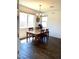 Bright dining area features a wooden table and chairs, chandelier and tile floors at 5466 Scotch Cap Dr, Las Vegas, NV 89122