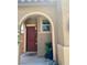 Home's inviting entryway features an arched doorway and a warm, welcoming ambiance at 5466 Scotch Cap Dr, Las Vegas, NV 89122